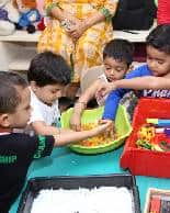 Preschool children enjoying sensory play.